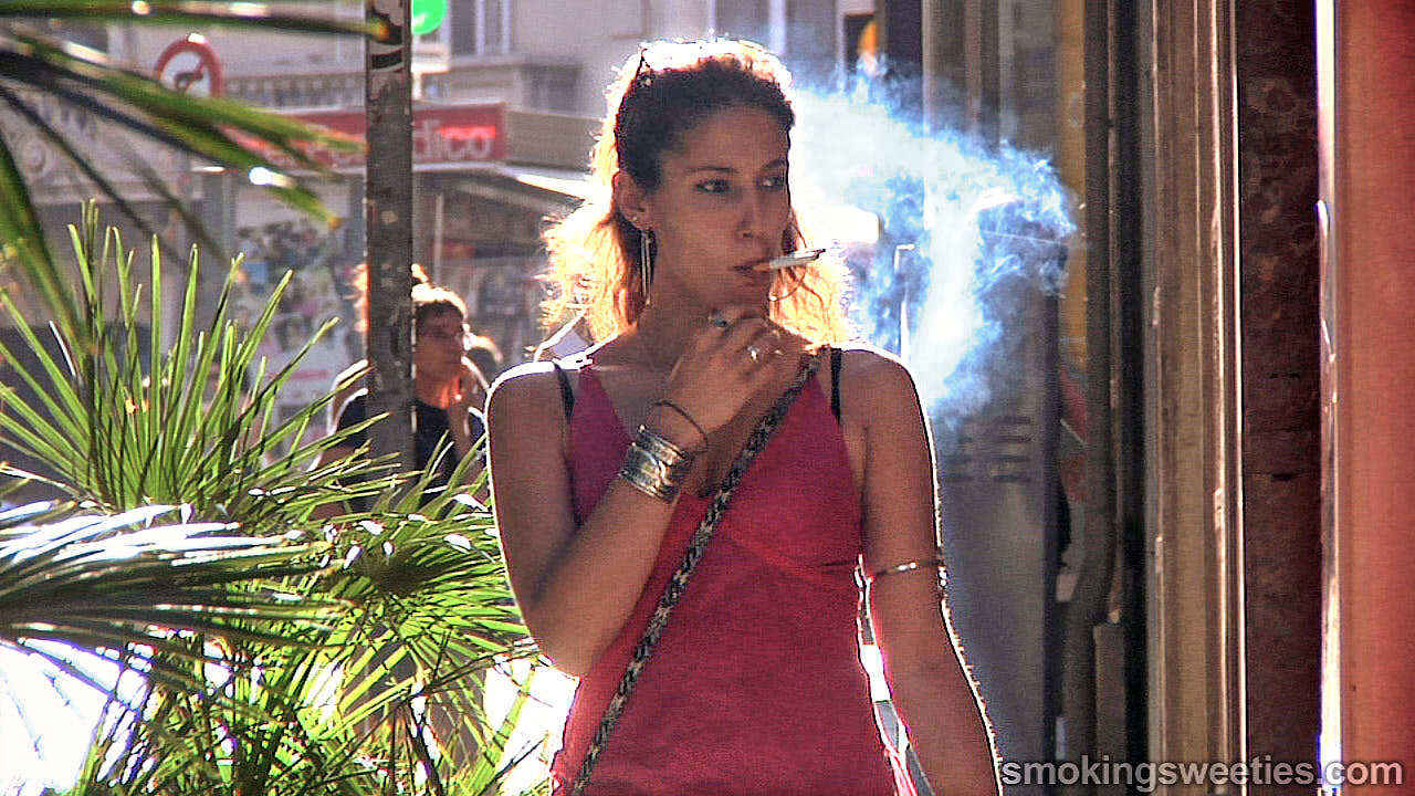 Elena: Smoking two cigarettes at once