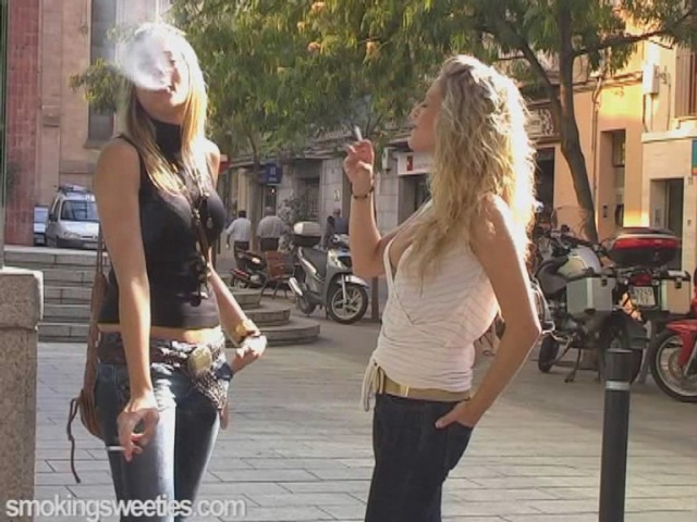 Cute cousins smoking on the street