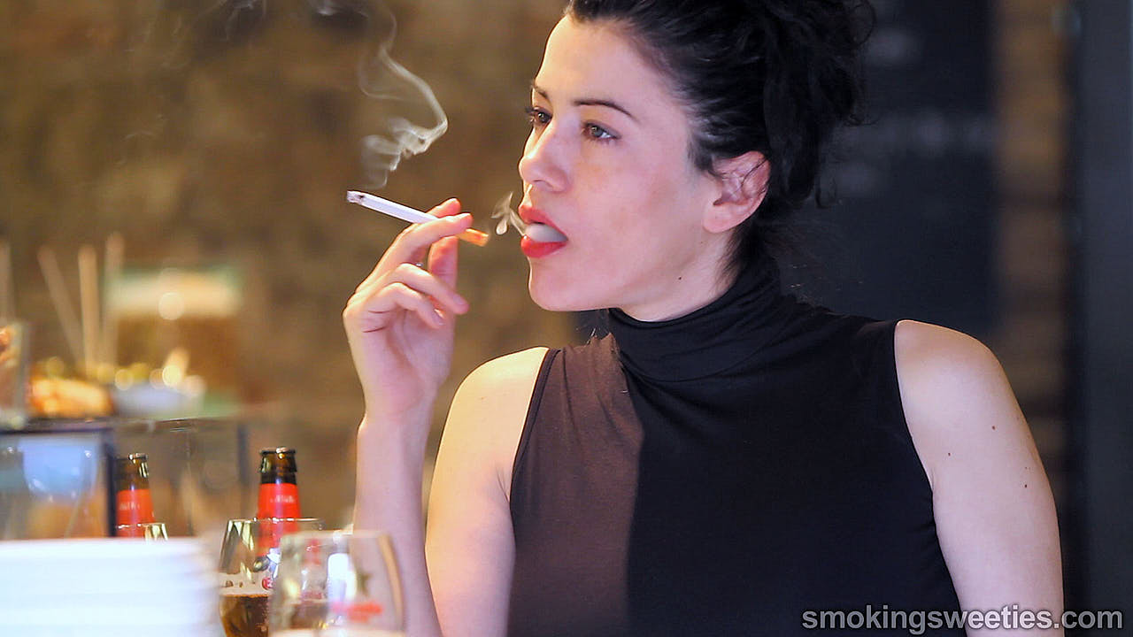 Angela: Chain smoking in a bar