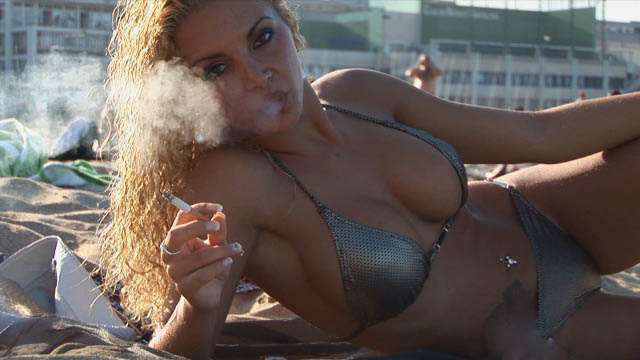Vanessa: smoking on the beach.